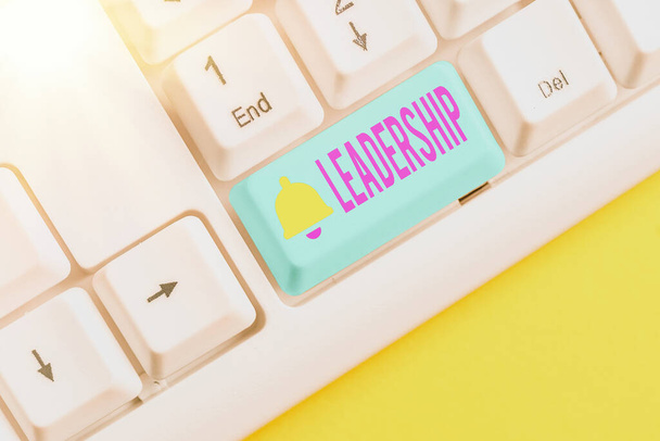 Handwriting text writing Leadership. Concept meaning ability to guide others without force into direction or decision Different colored keyboard key with accessories arranged on empty copy space. - Photo, Image