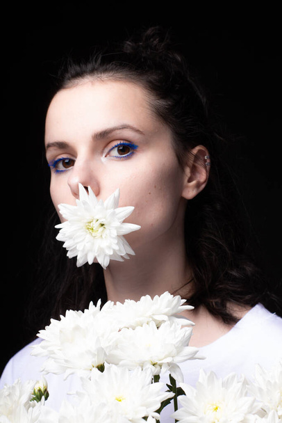 woman with flowers, black background - Foto, imagen
