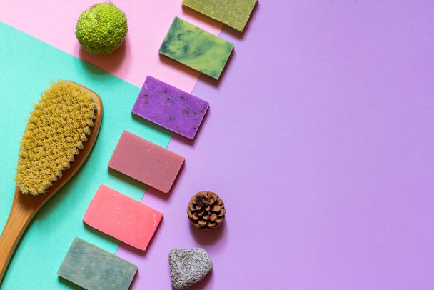 Multi-colored handmade soap made from natural ingredients on a colored background. the layout of the space - Photo, Image
