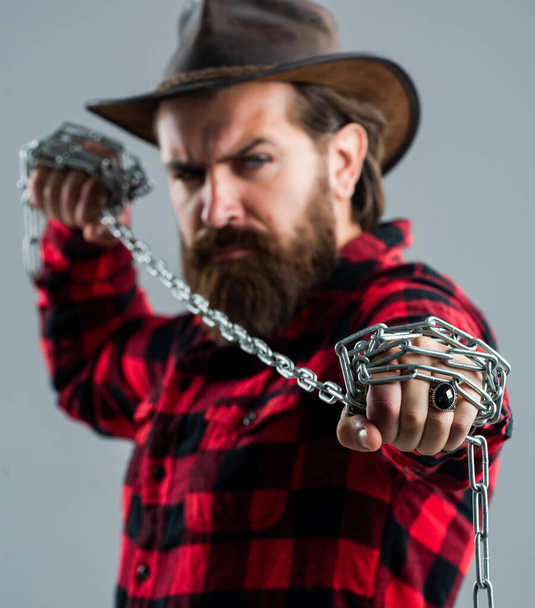 you are next. problem solving. man in captivity. concept applicable for business. man tearing heavy steel chain by hands. conceptual symbol of freedom. male fashion. strong man with chains - Photo, Image
