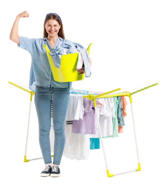 Woman with clean clothes and dryer on white background - Photo, Image