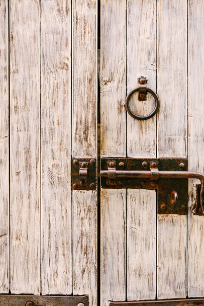 Wooden door with metal bolt and ring handle - Zdjęcie, obraz