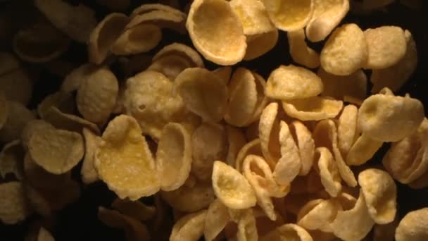 Breakfast Corn Flakes Flying in the Air in Slow Motion on Black Background 4K - Footage, Video