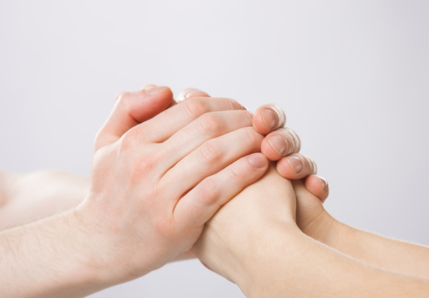 Man's hands gently holding woman's hands - Foto, Imagen