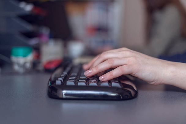 Woman's hands typing on computer keyboard, close up shot - Fotografie, Obrázek