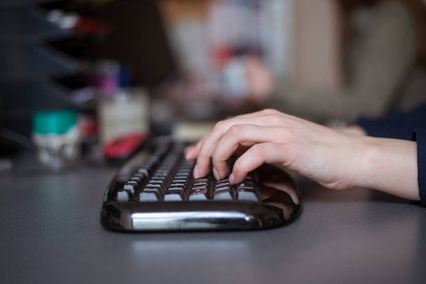 Woman's hands typing on computer keyboard, close up shot - Fotoğraf, Görsel