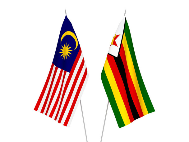 Εθνικές σημαίες υφάσματος της Μαλαισίας και της Ζιμπάμπουε απομονωμένες σε λευκό φόντο. 3d απεικόνιση απόδοση. - Φωτογραφία, εικόνα