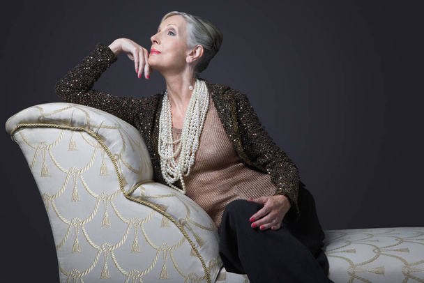 Wealthy Senior Woman on Chaise Lounge - Photo, image
