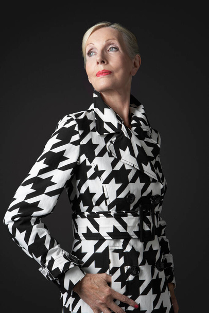 Stylish Senior Woman in black and white coat - Photo, image