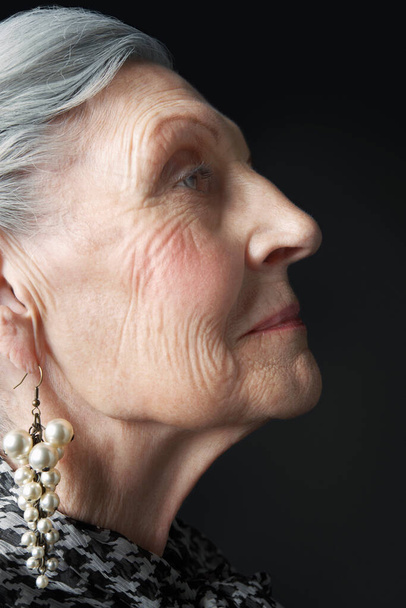 Senior Woman with Pearl Earrings - 写真・画像