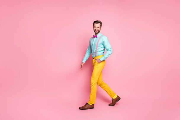 Full length body size view of his he nice attractive elegant fashionable content cheerful cheery bright bearded guy artist walking stage scene mc isolated over pink pastel color background - Фото, зображення