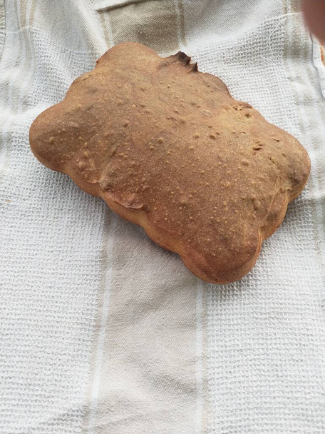 Homemade bread on a background from a cloth - Photo, Image