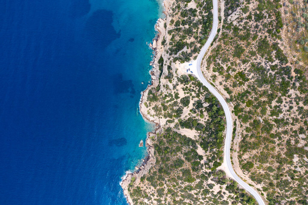 Curve winding road along the coast of Thassos island, Greece Aerial views. - 写真・画像