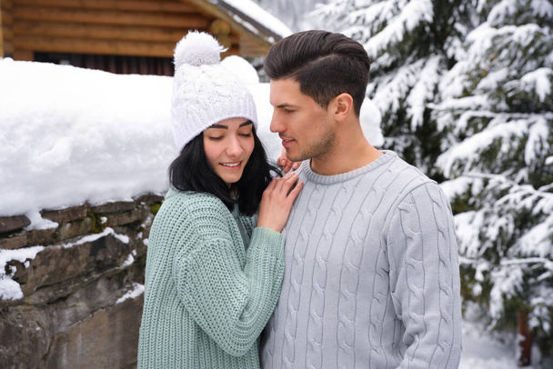 Happy couple in warm sweaters outdoors on winter day - Fotografie, Obrázek