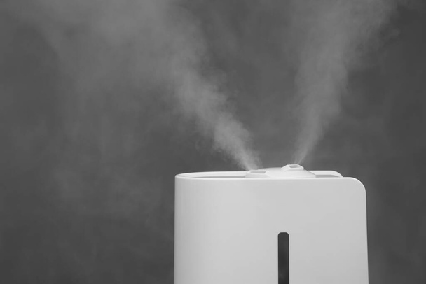 Modern air humidifier on grey background, closeup. Space for text - Zdjęcie, obraz