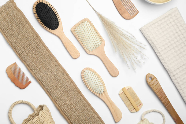 Composition with hair combs and brushes on white background, top view - Foto, imagen