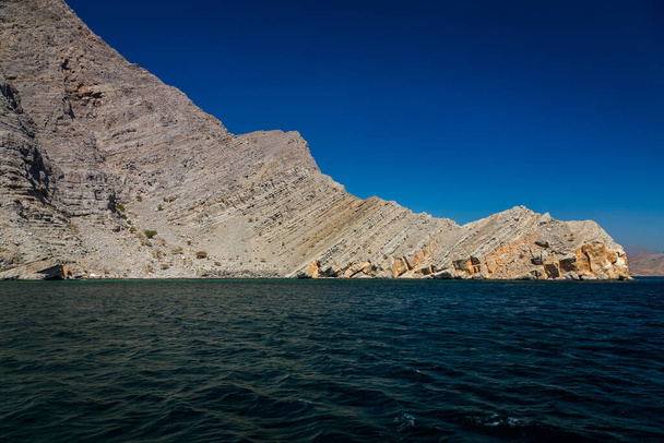 Beautiful coastal scenery near Khasab, in Musandam peninsula, Oman, photo taken from a boat during a tour - Photo, Image