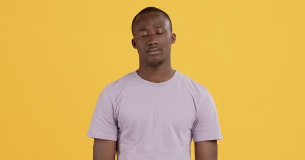 Portrait of cute sad african american guy, pouting lips - Video, Çekim