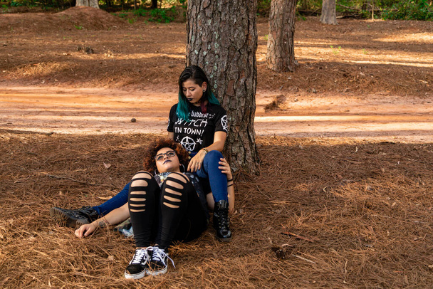 Lesbian girlfriends couple on a beautiful sunny day in the park. - Valokuva, kuva