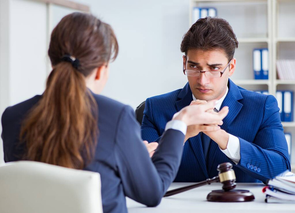 Lawyer talking to his client in office - Photo, image