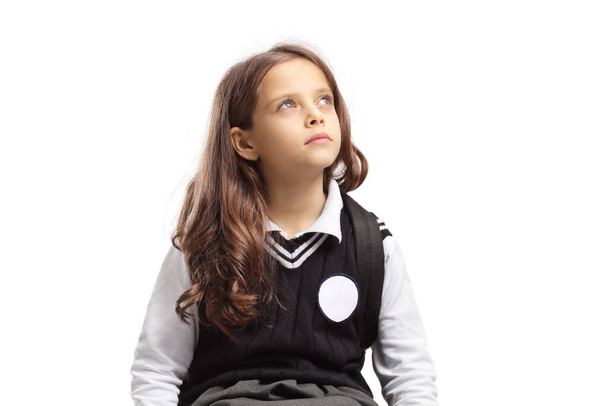 Pensive child looking up isolated on white background - 写真・画像