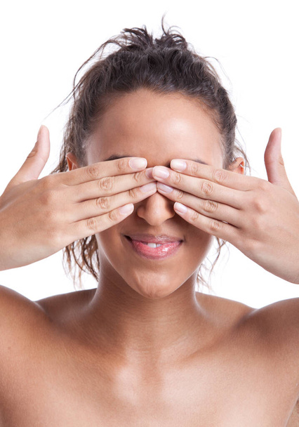 Young Mixed Race woman covering her eyes with hands against white background - Fotó, kép