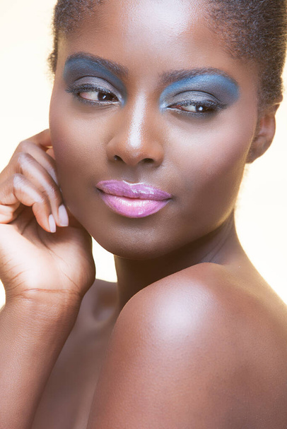 Portrait of young attractive african american woman with full make up on in studio - Fotoğraf, Görsel