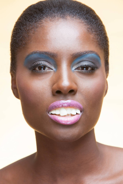 Portrait of young attractive african american woman with full make up on in studio - Zdjęcie, obraz