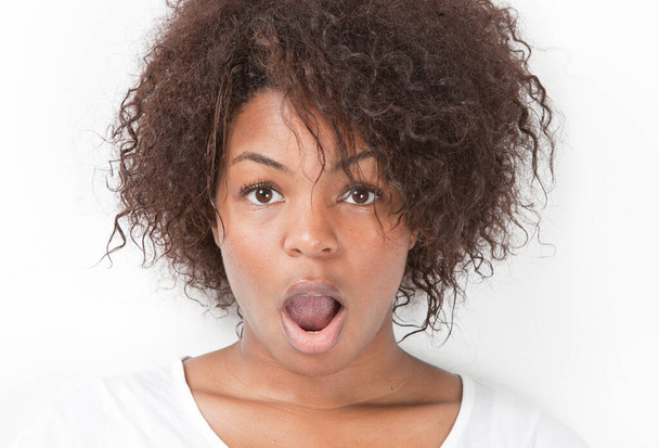 Portrait of amazed young woman with mouth open against white background - Φωτογραφία, εικόνα