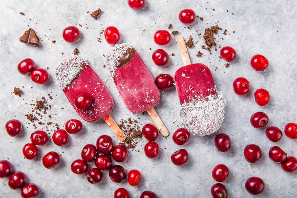 Homemade Vegan Cherry Popsicles with Coconut Milk. Summer food concept top view - Photo, Image