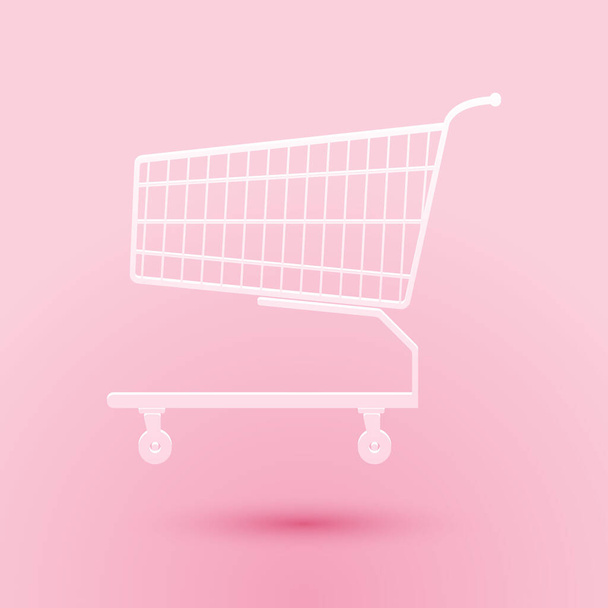 Paper cut Shopping cart icon isolated on pink background. Online buying concept. Delivery service sign. Supermarket basket symbol. Paper art style. Vector - Vektor, Bild