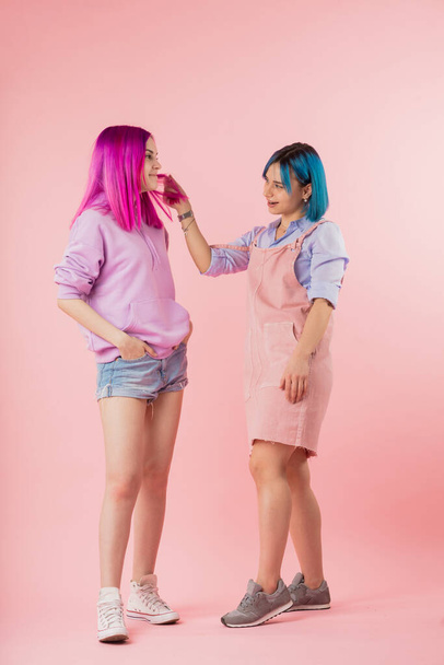 two creative girls enjoy their hairstyles - Фото, зображення