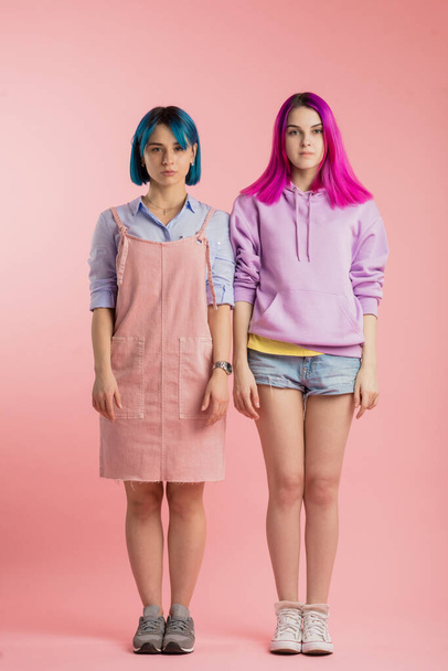 two awesome creative girls standing still - 写真・画像