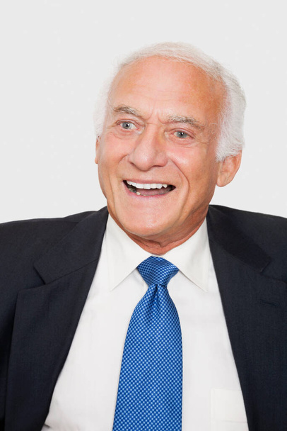 Happy elderly businessman against white background - Foto, Bild