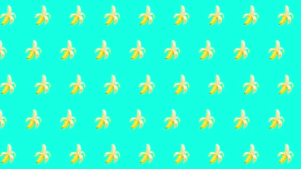 Motion design banana. An animated element banana on mint background. - Кадри, відео