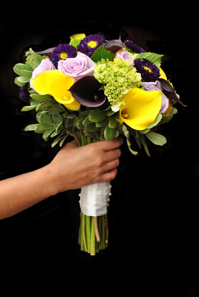 Holding Bridal Flowers with a Black Background - Photo, Image