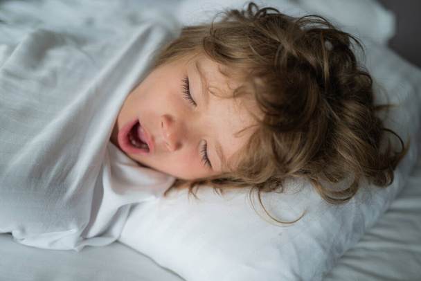 Kids morning wake up. Close-up portrait of sleeping child. - Fotografie, Obrázek