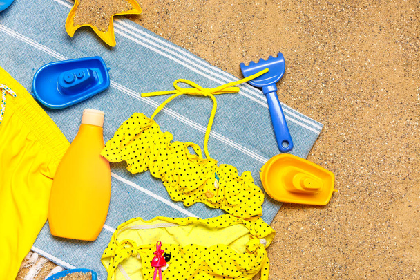 Set of beach accessories for children on sand, felső nézet - Fotó, kép