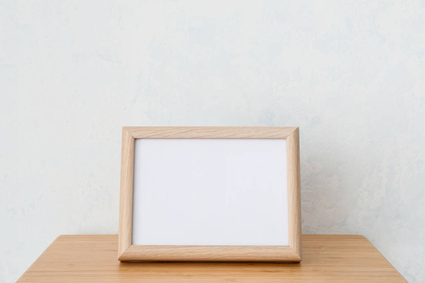 Photo frame on table in room - Photo, Image