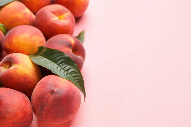 Many ripe peaches on color background - Photo, Image
