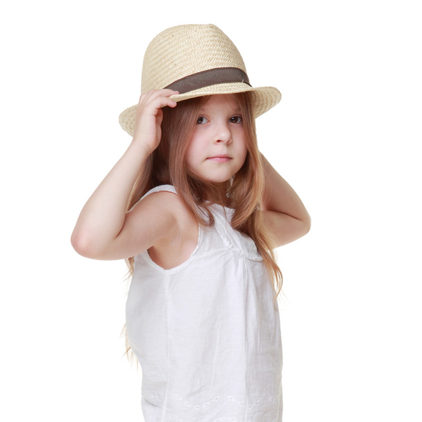 Girl in a summer dress and a hat - Фото, зображення