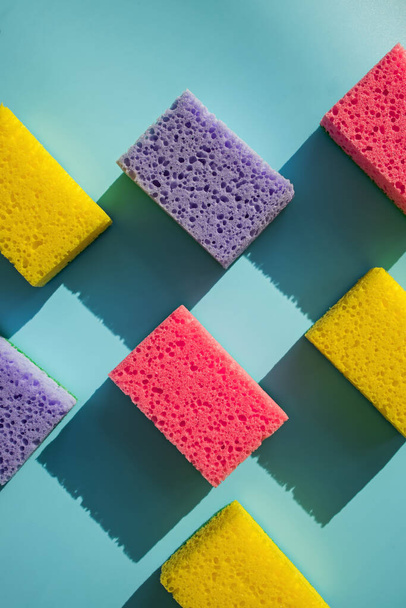 Cleaning sponges for washing dishes on blue background i - Photo, Image