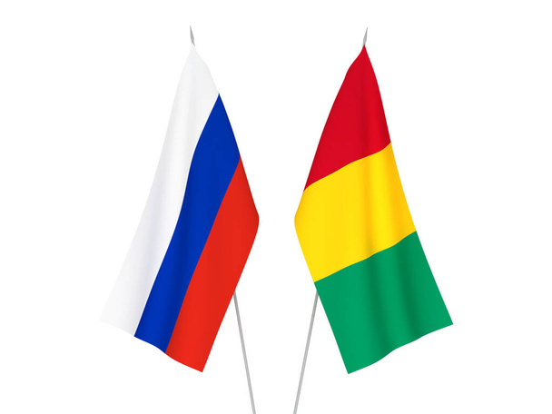 Εθνικές σημαίες υφάσματος της Ρωσίας και της Γουινέας που απομονώνονται σε λευκό φόντο. 3d απεικόνιση απόδοση. - Φωτογραφία, εικόνα