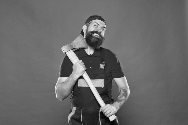 going crazy male. concept of hairdressing. Handsome happy man with axe. making his beard shape. Agriculture and forestry theme. Power and strength. Danger concept. Brutal lumberjack with iron axe - Foto, imagen