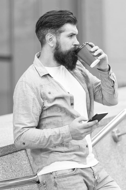 Internet surfing social networks with smartphone. Energy. Coffee time. Waiting for message. Modern life. Man with smartphone drinking coffee. Mobile phone always with me. Man use smartphone - Фото, изображение