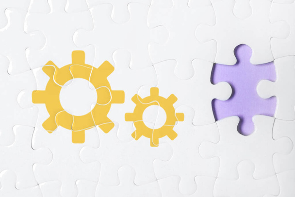 Teamwork concept. White puzzle with missing piece on violet background, top view - Fotó, kép