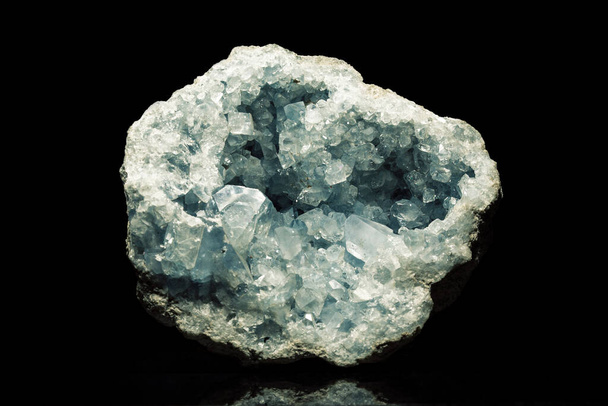 Celestine mineral stone in front of black - Foto, afbeelding