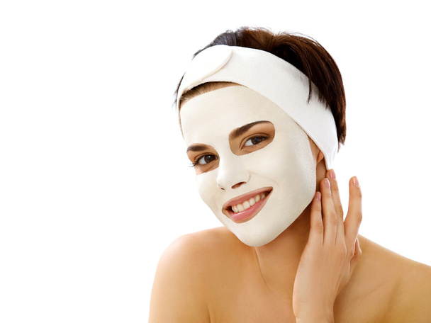 Beautiful Woman Getting Spa Treatment. Cosmetic Mask on Face. Skin Care - 写真・画像