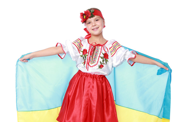 Girl in a beautiful national Ukrainian suit - Фото, изображение