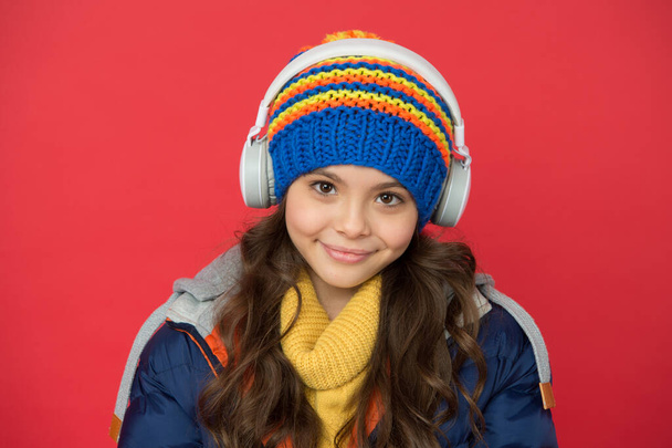 Vacation ideas. Listening music. Music taste. Weekend begins like that. Hipster fashion trend. Winter holidays activity. Feeling warm and happy. Cheerful smiling child stylish outfit listen music - Foto, Imagem